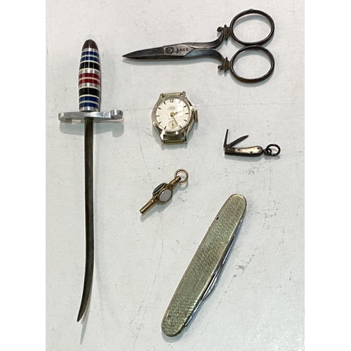 90 - A miniature penknife with two blades (3 cm with blade extended); watch key set with coloured stones ... 