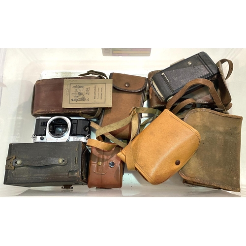 94 - A Canon AE-1 SLR camera and a collection of vintage box and other cameras.