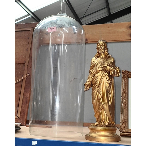 120 - A 19th century metal figure of Christ under a glass dome.