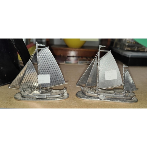 131 - A 19th century railway lantern; a 2 masted model yacht