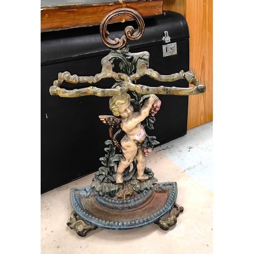 133 - A 19th century cast iron stick stand with cherub and vine decoration