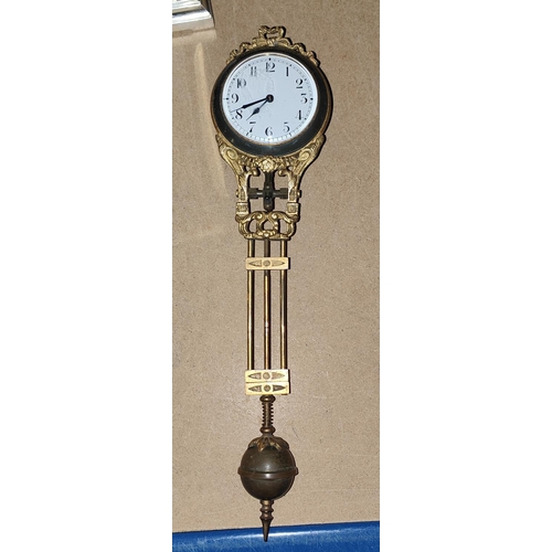 137 - A pendulum clock in ormolu case (no stand); a 400 day clock; a reproduction carriage clock