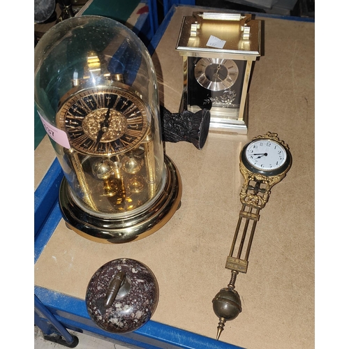 137 - A pendulum clock in ormolu case (no stand); a 400 day clock; a reproduction carriage clock