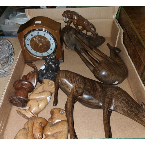 143A - A 1930's mantle clock and a collection of carved treen animals etc