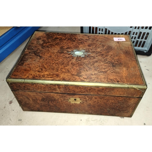 144 - A 19th century burr walnut and brass bound writing desk with leather interior surface, ink wells, fe... 