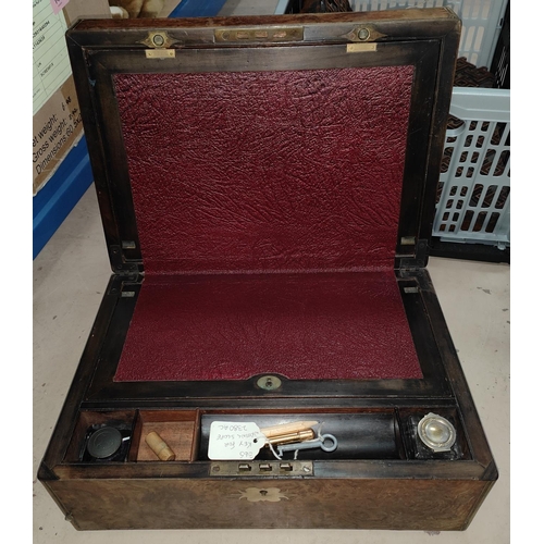 144 - A 19th century burr walnut and brass bound writing desk with leather interior surface, ink wells, fe... 