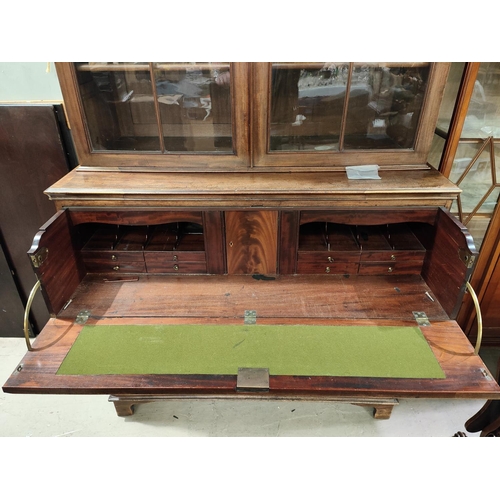 903 - A George III mahogany secretaire/bookcase, the upper section enclosed by 2 Gothic arch glazed doors,... 