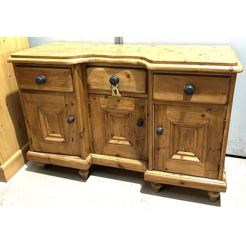 921 - A pine side cabinet having three cupboards and three drawers, length 128cm