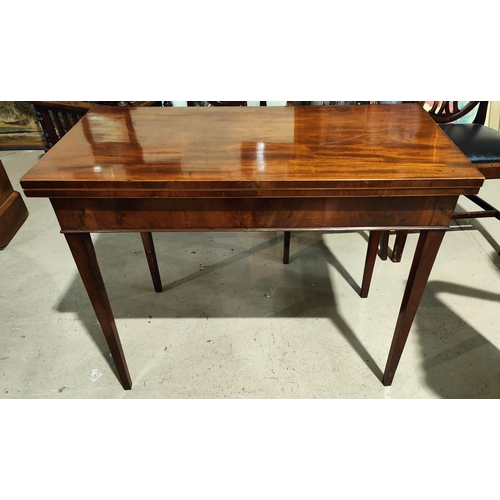 895 - A 19th century Sheraton style mahogany side table, the rectangular fold-over top with boxwood line i... 