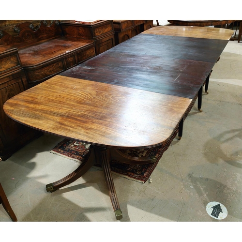 905 - A 19th century Georgian style mahogany dining table, with extending 'D' ends, twin pedestals with tu... 