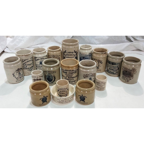 86 - A collection of stoneware jars with later transfer advertising labels.