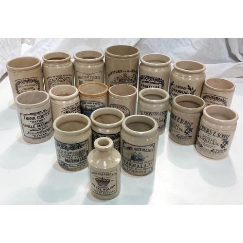 87 - A collection of stoneware jars with later transfer advertising labels.