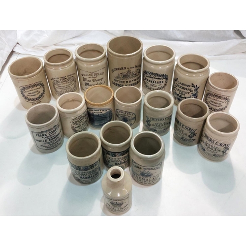 87 - A collection of stoneware jars with later transfer advertising labels.