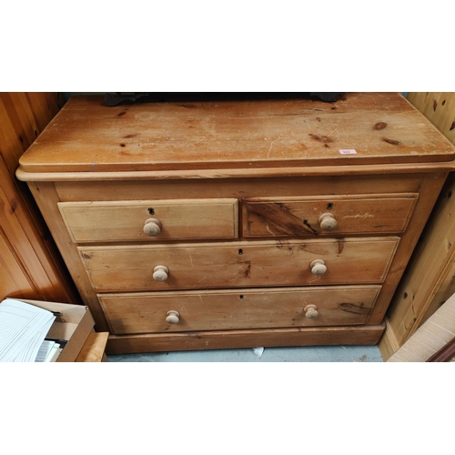 922 - A stripped pine chest of two long and two short drawers, length 107cm, height 83cm.