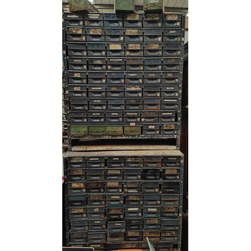 923 - A large two height unit of industrial drawers with a large quantity of small drawers for collecting ... 