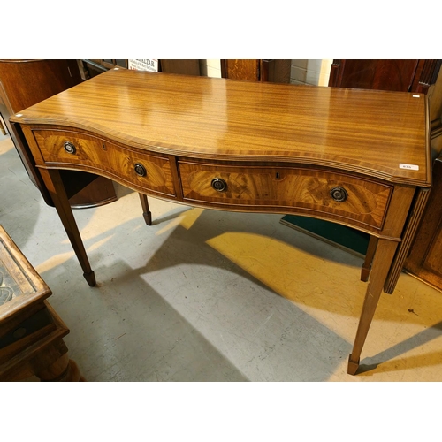 872 - A Regency style mahogany side table with crossbanded decoration, serpentine front, 2 drawers and dro... 