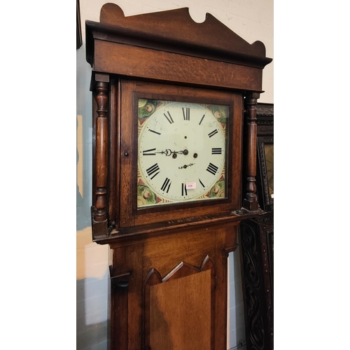 873 - An early 19th century oak and mahogany longcase clock with architectural pediment and turned columns... 