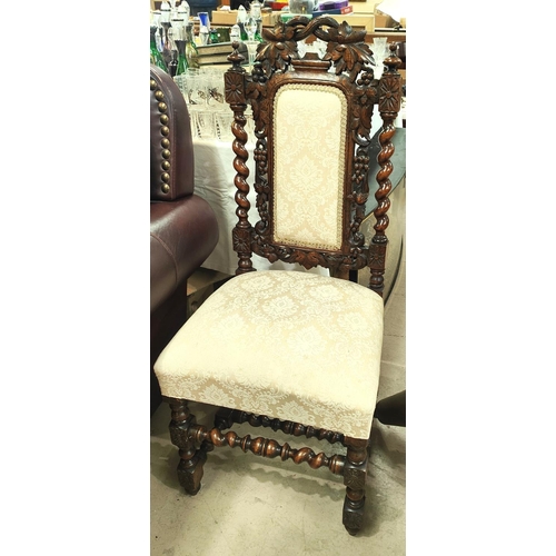 900 - A carved oak hall chair with barley twist supports with grape and vine decoration, and three balloon... 