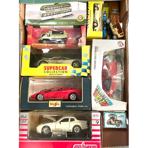 310 - A collection of boxed diecast vehicles, 1/24 scale and other smaller, Majorette, Porsche, Jet Age Mi... 