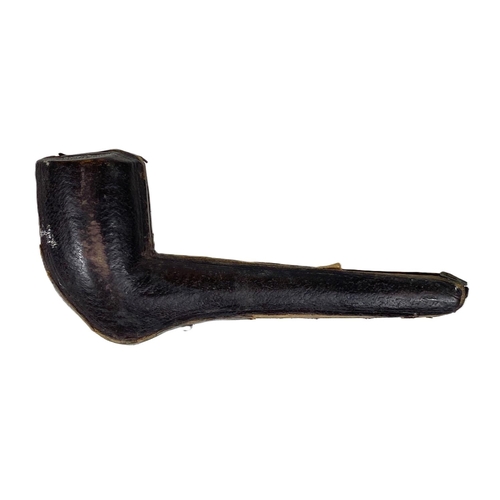 118A - A 19th century meerschaum style pipe with a silver mounted amber stem, cased.