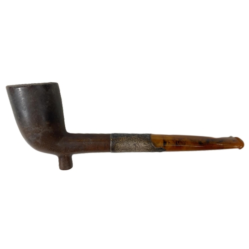 118A - A 19th century meerschaum style pipe with a silver mounted amber stem, cased.