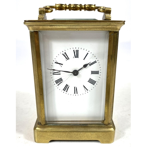 134 - A 19th century French carriage clock with white dial and timepiece movement