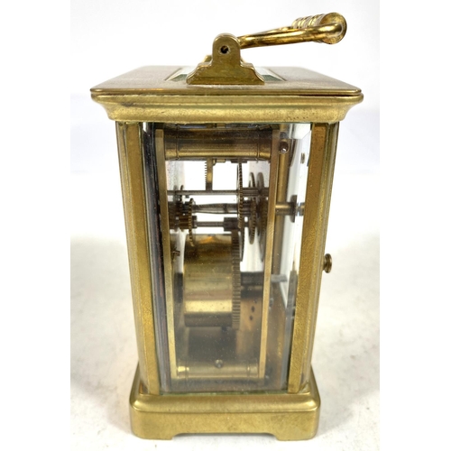 134 - A 19th century French carriage clock with white dial and timepiece movement