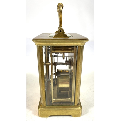 134 - A 19th century French carriage clock with white dial and timepiece movement