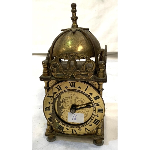 16 - A 20th century brass carriage clock; a reproduction brass carriage clock; a period style brass mante... 