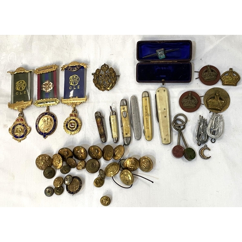 18 - A collection of military buttons; badges; penknives; etc.