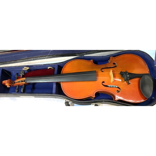 20 - A 20th century students two piece backed violin in hard carry case with bow, full size; A 20th centu... 