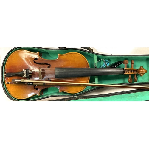 20 - A 20th century students two piece backed violin in hard carry case with bow, full size; A 20th centu... 