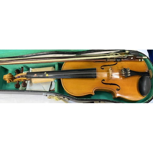 23 - A 20th century Lark students violin with two piece back, carry case and two bows
