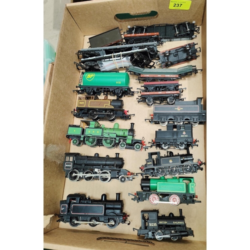 237 - Seven various 00 gauge locomotives; 2 tenders; a selection of rolling stock