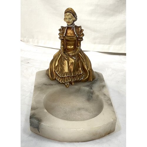 29 - A 1920's polished marble dish with applied figure of a girl in Regency dress, 18cm