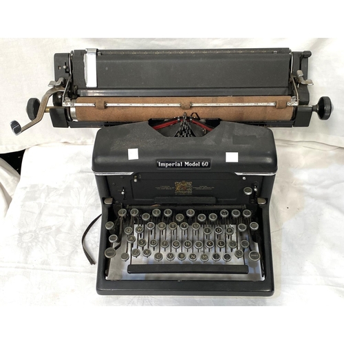 35 - An Imperial model 60 typewriter and two cased travel typewriters