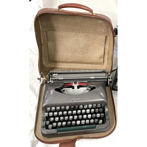 35 - An Imperial model 60 typewriter and two cased travel typewriters