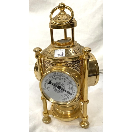 39 - A reproduction brass meteorological clock with three faces and a brass 19th century inkwell with cen... 