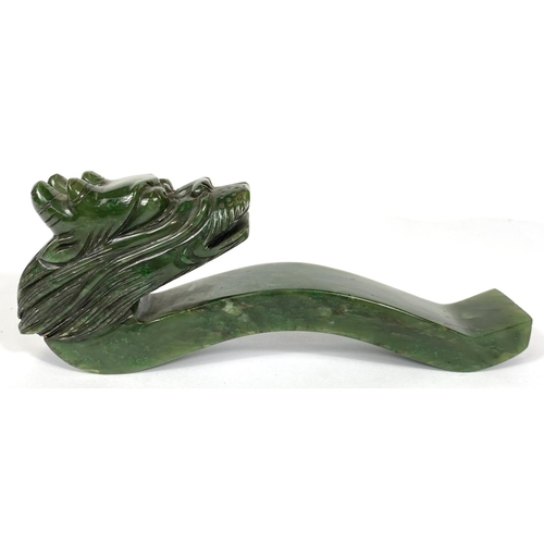 484A - A Chinese spinach jade dragons head sceptre, 17cm length