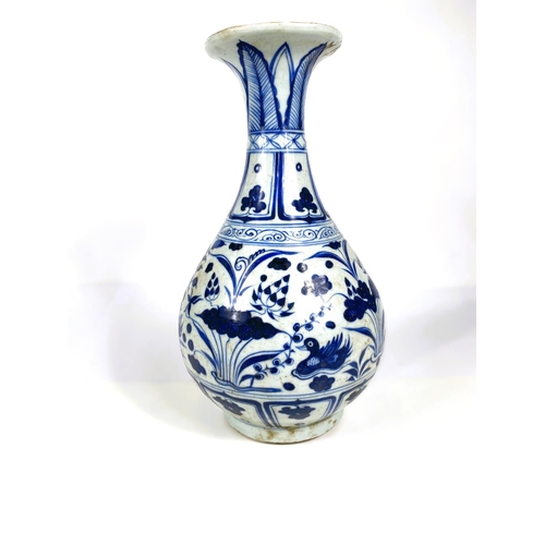 485 - A Chinese blue and white vase of ovoid form with flared rim decorated with flowers and birds, 34cm