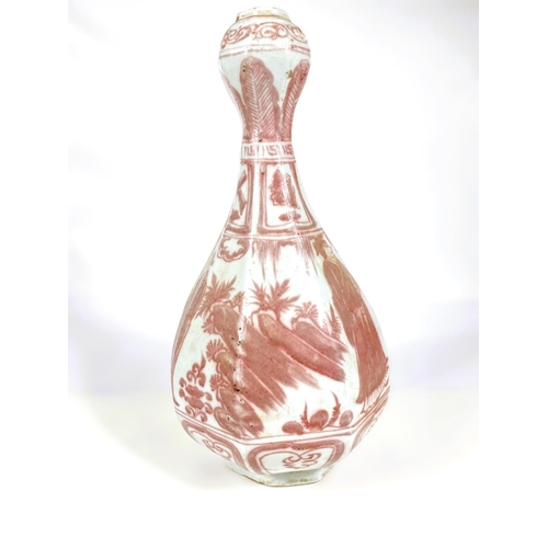 486 - A Chinese porcelain vase of octagonal form with garlic bulb top, decorated in underglaze iron red wi... 