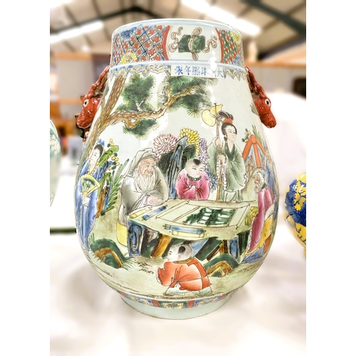 487 - A Chinese ovoid vase of large size with deers head handles, decorated in colour enamels with genre s... 