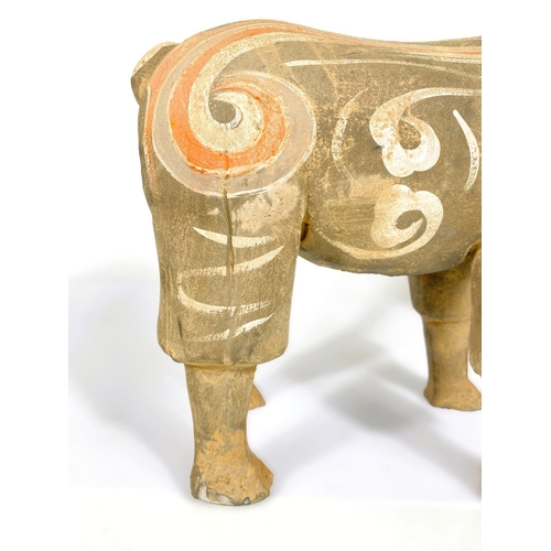 489 - A Chinese under glazed pottery figure of a goat in the archaic style, painted decoration, 30cm high