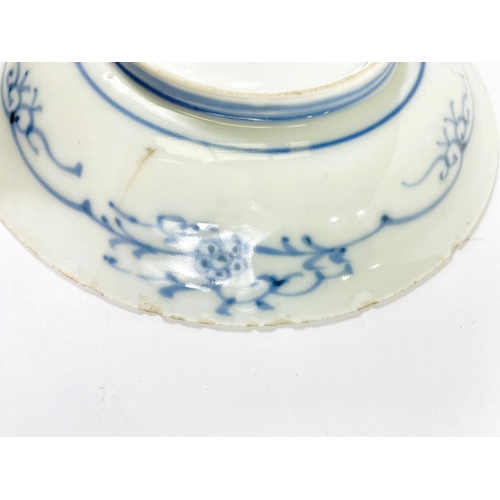 489A - A Japanese porcelain dish decorated with a fruit nestled in a branch, 4 character mark, 15cm (hairli... 