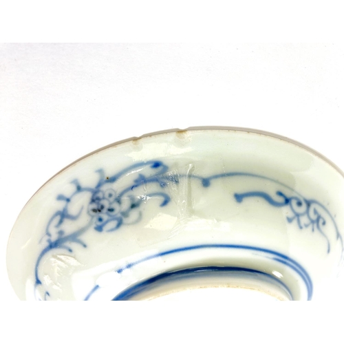 489A - A Japanese porcelain dish decorated with a fruit nestled in a branch, 4 character mark, 15cm (hairli... 