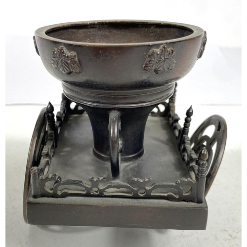 492A - A Japanese bronze table ornament in the form of a rickshaw, 27cm length