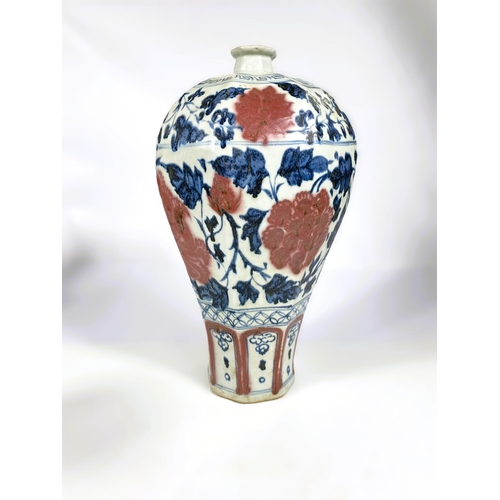 493 - A Chinese porcelain octagonal meiping vase decorated in underglaze blue and iron red with stylised f... 