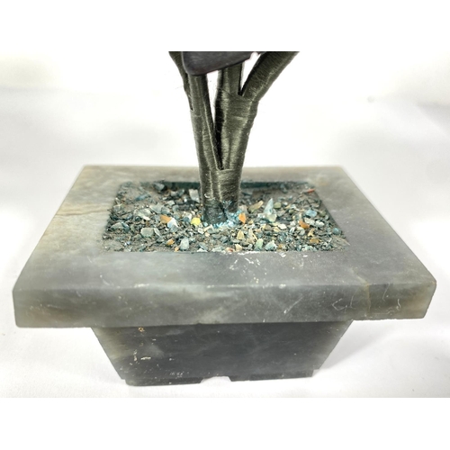 493A - A Chinese polished hardstone table decoration with floral sprays, 22cm