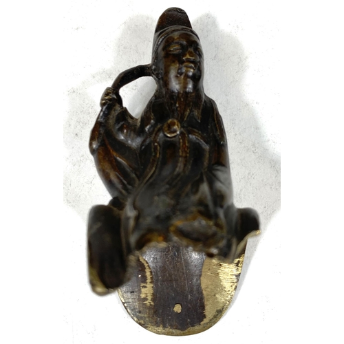 496B - A Chinese bronze censor in the form of a man on horseback (man's legs missing), length 17cm