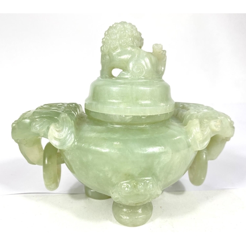 497A - A Chinese jade coloured hardstone censor with hoop handles, mythical beast carved finial and side mo... 